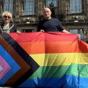 Photo of the Mayor of Wirral, Councillor Mary Jordan, and the Founder of Wirral Pride, Jamie Lee Carter, raising the Rainbow Flag at Wallasey Town Hall