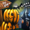 Halloween pumpkins with sign say "Halloween this way" and haunted castles in background