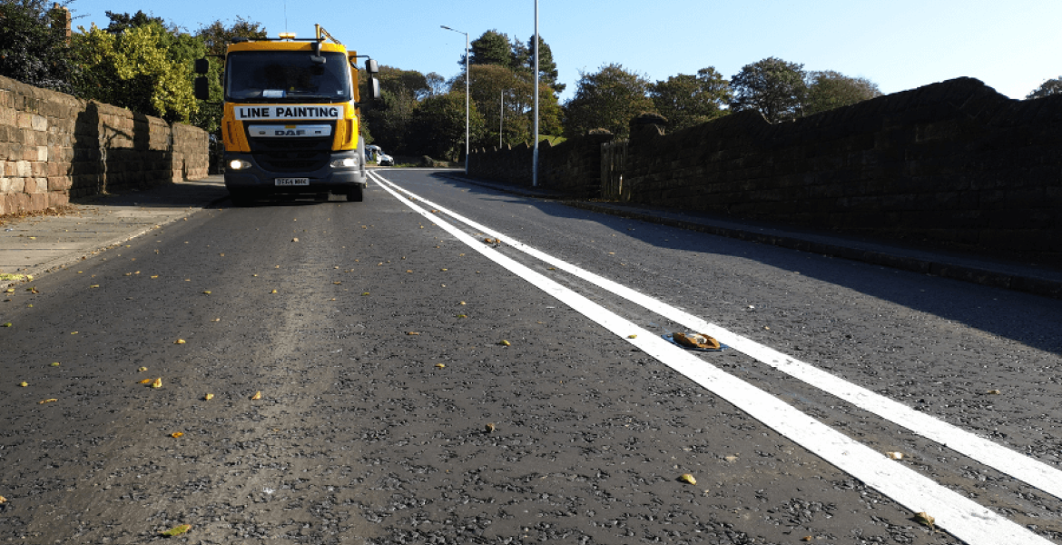 A road laid with Hot Rolled Asphalt has new lines painted on