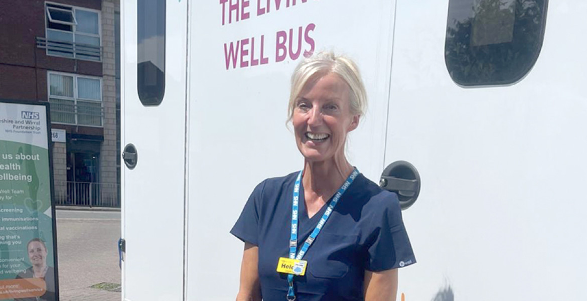 picture of clinical lead, heledd, in front of the bus