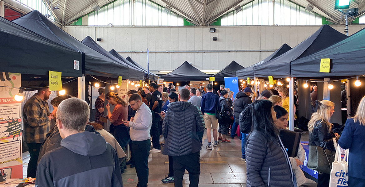 Photo of numerous stalls and lots of people at the Birkenhead jobs fair