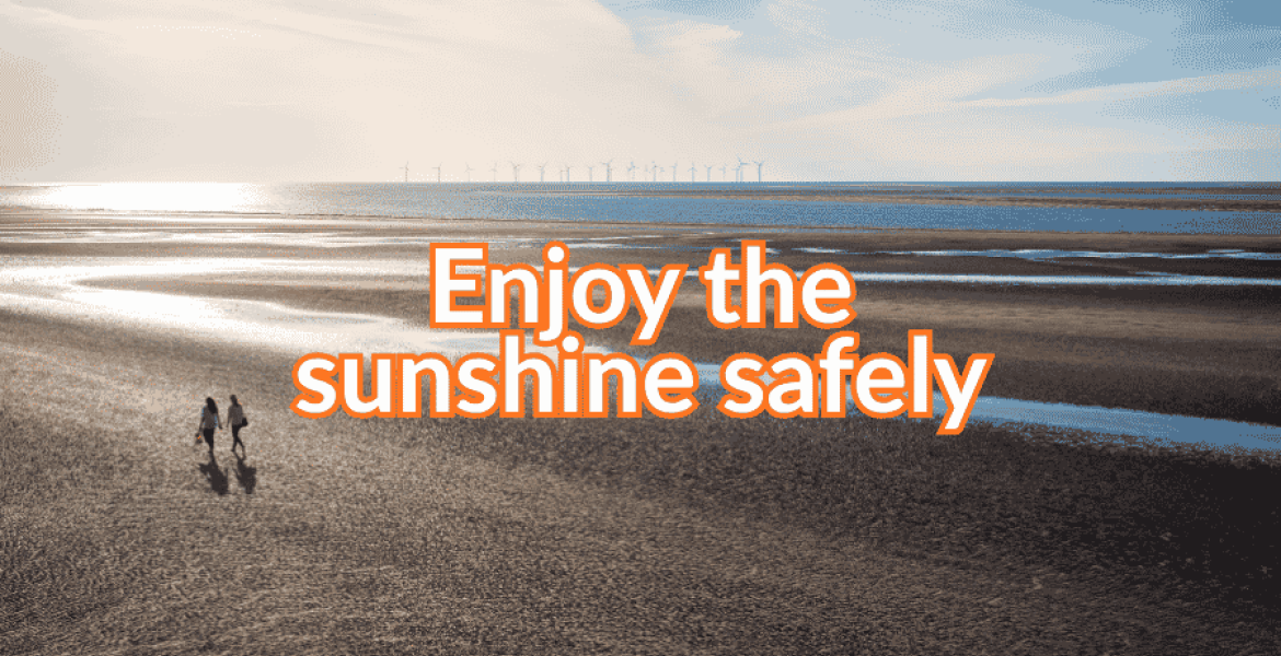 Photo of a sunny beach with the words: Enjoy the sunshine safely
