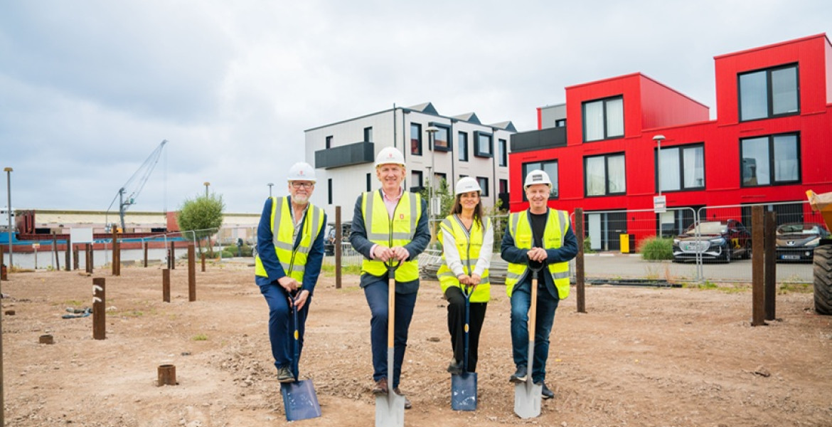 From left, each wearing PPE and holding a spade: Cllr Mark Skillicorn, James Wittaker, Lisa Forshaw and Lyndon Forshaw. Image courtesy of Peel Waters